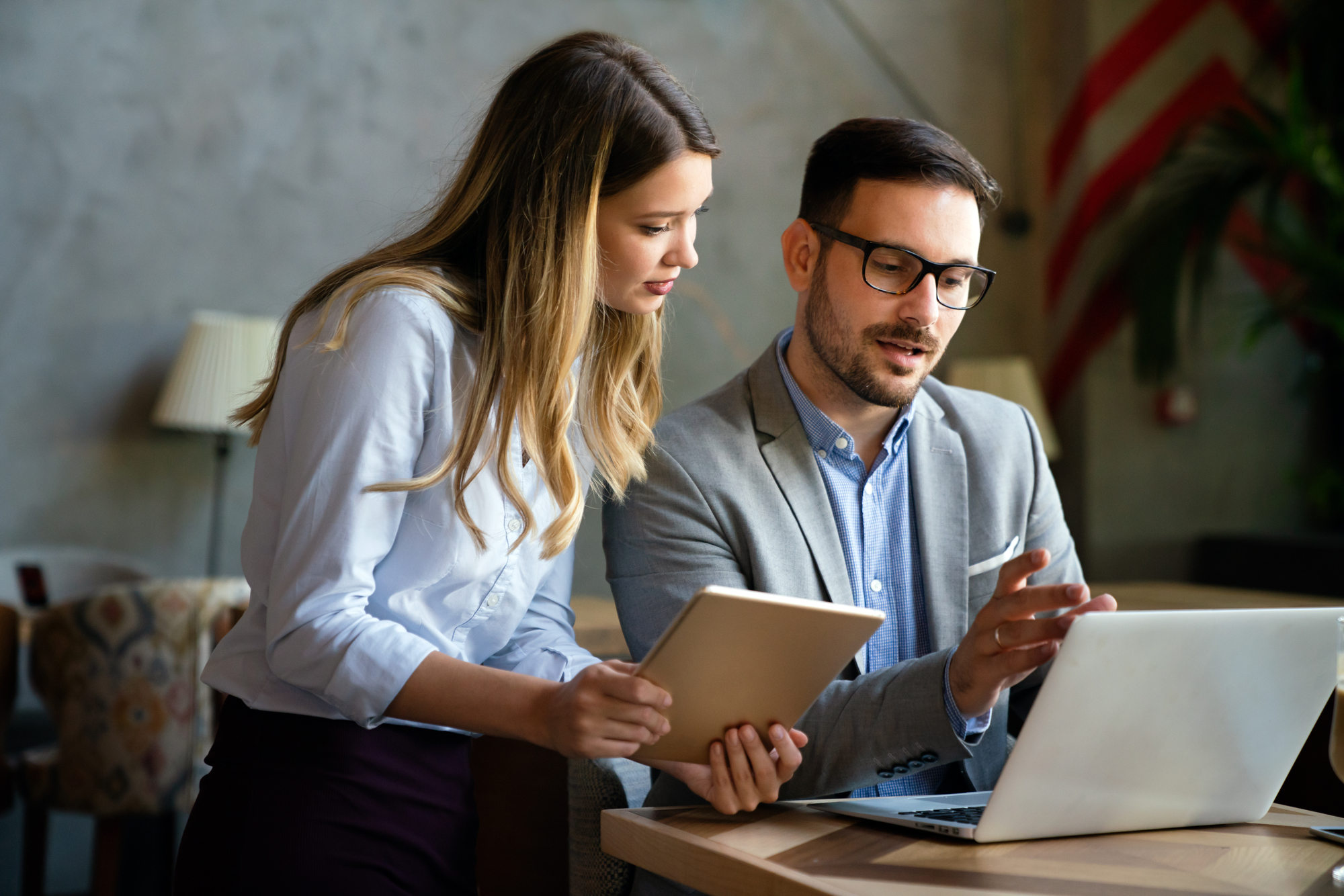 Portrait of success business colleagues working, smiling together in office.